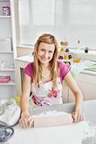 Portrait of a beautiful woman baking in the kitchen 
