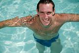 Portrait of male in swimming pool looking to camera