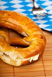 bavarian pretzel with butter isolated on white
