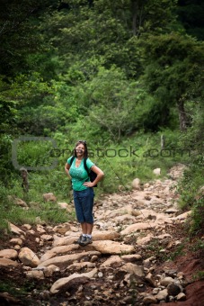 Female hiker on a rugged rustic trail in Costa Rica