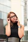 beautiful  young businesswoman talking by mobile phone 