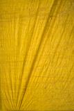 Yellow tarpaulin with folds