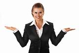 smiling modern business woman presenting something on empty hands