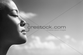 Woman with eyes closed.