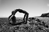 Nude woman practicing yoga.
