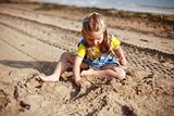 Kid playing on beach