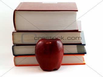 Apple in front of book