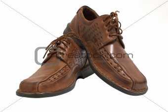 Pair of brown shoes isolated on white