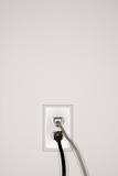 Wall outlet with plugs.