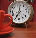 Coffee cup and alarm clock