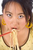 Eating noodles with chopsticks