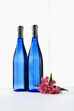 Blue bottles with flower.
