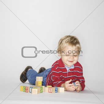 Boy playing with blocks.