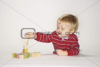 Boy playing with blocks.