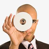 Man holding compact disc.