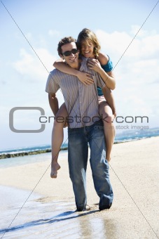 Man carrying woman.