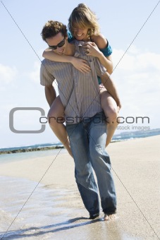 Man carrying woman.
