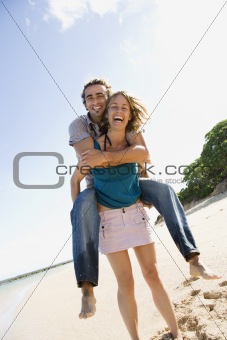 Woman carrying man.