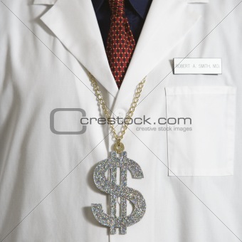Doctor wearing dollar sign.