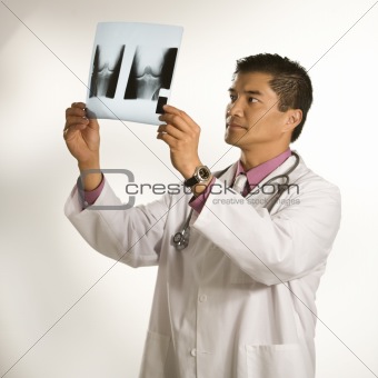 Doctor examining x-ray.