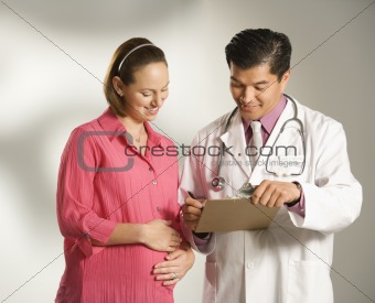 Doctor and pregnant woman.