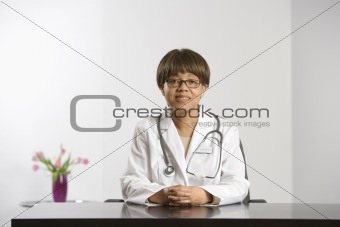 Doctor at desk.