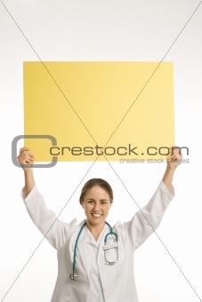 Doctor holding blank sign.