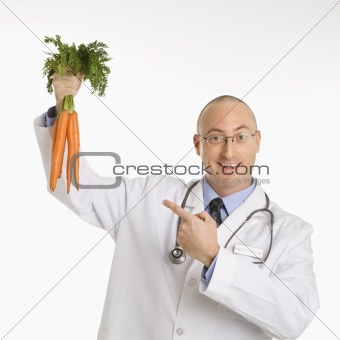 Doctor holding carrots.
