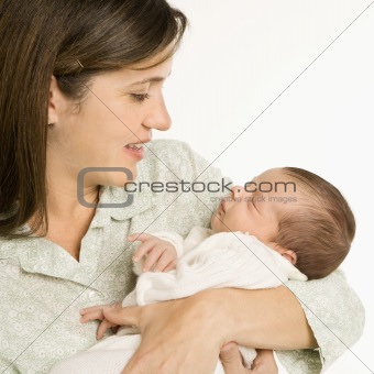 Smiling mother holding baby.