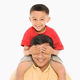 Boy on father's shoulders.