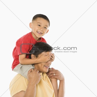 Son on father's shoulders.