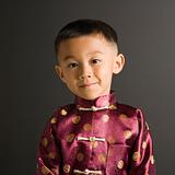 Asian boy in traditional costume.