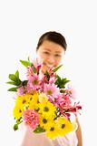 Asian woman holding flowers.