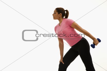 Woman exercising with dumbbell.