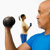 Man exercising with dumbbell.