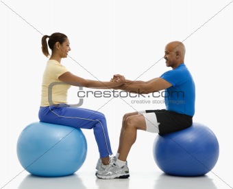 Man and woman exercising.