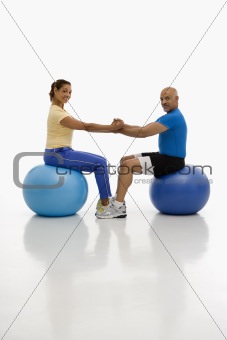 Man and woman exercising.