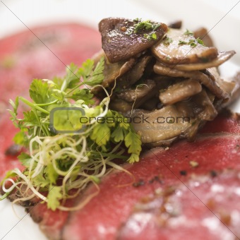 Beef carpaccio with mushrooms.