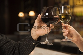 Hands toasting wine.