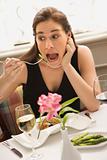 Woman exaggerating eating.
