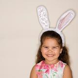 Girl wearing bunny ears.