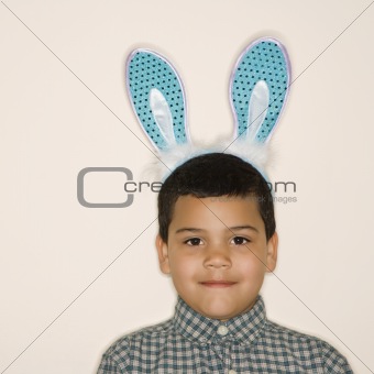 Boy wearing bunny ears.