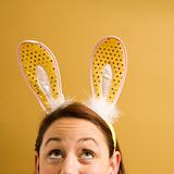 Woman wearing rabbit ears.