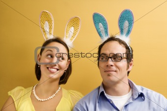 Couple wearing rabbit ears.