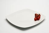 Tomatos in white plate