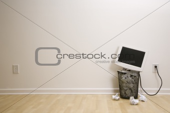 Computer in trash can.
