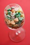 Candy hearts in glass.