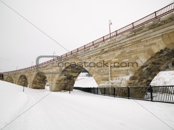 Snowy bridge scene.