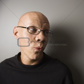Man with puckered lips.