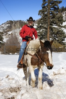 Male horseback riding.